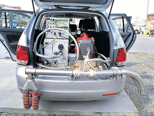 A photo of a device mounted in the trunk of a Volkswagen to collect and measure diesel exhaust fumes while the car was driven on the road. INYT