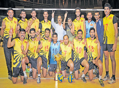 CHAMPIONS: Postal, the winners of the 'A' division volleyball championship, in Bengaluru onMonday. STANDING: (fromleft) Sudharshan, Ganesh K, Manjunath,KRLakshminarayan (coach), GNL Prasad (Asst. Director of Sports),KS Suresh (Asst. Coach), Karthik A, Abijith, Chandan (manager) and Raison. KNEELING: Louis, Suraj Naik, Vinayaka, Jeevan, Satish A, Pavan and Karthik SA. DH PHOTO