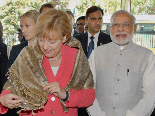 German Chancellor Angela Merkel and Prime Minister Narendra Modi. PTI Photo.
