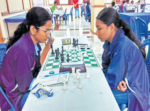 FOCUSED Tamil Nadu's Varshini V (right) in action against her State-mate Mahalakshmi on Tuesday.