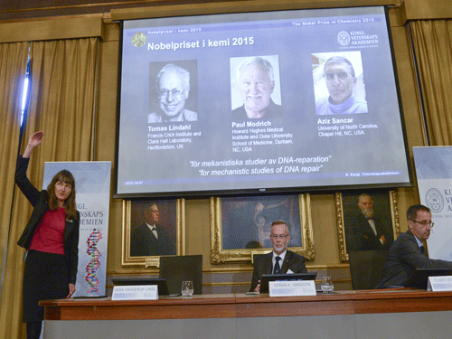 Professors Sara Snogerup Linse, Goran K. Hansson and Claes Gustafsson, members of the Nobel Assembly, talk to the media at a news conference at the Royal Swedish Academy in Stockholm. Reuters Photo.