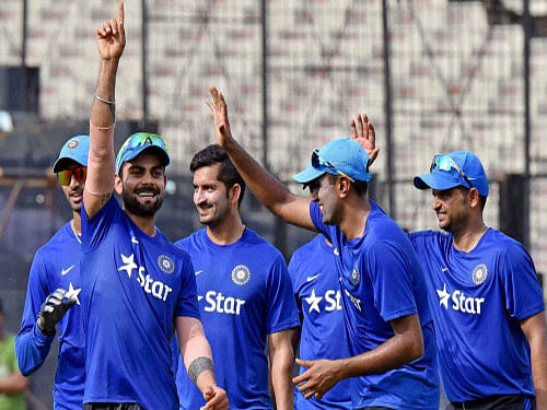 Indian cricketers share a light moment during a training session on the eve of the third T20 International against South Africa at the Eden Gardens in Kolkata. The South Africans lead the series 2-0. PTI