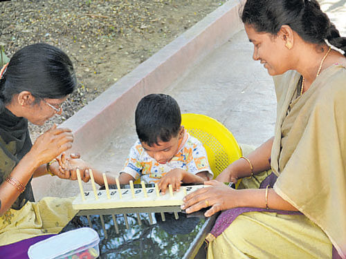 A child engrossed in an activity at Tamahar.