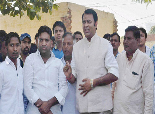 BJP MLA Sangeet Som visits Dadri village where a man was recently lynched by mob for allegedly having beef. PTI Photo