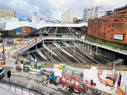 1)&#8200;An external view of the Birmingham New Street Station under construction. The concourse and the rails are seen, while the new media eye is being installed. 2)&#8200;An aerial view of the new roof of the station being constructed, adding character to the previous flat structure. 3)&#8200;A view of the demolished upper retail levels through the atrium under construction. The structure allows for natural skylight to enliven the station precincts.