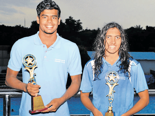 all smiles BAC's Arvind M (left))&#8200;and Malavika V pose with their best swimmer spoils on Sunday. DH Photo