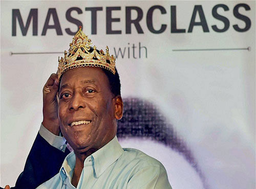 Legendary Brazilian footballer Pele wearing a crown during a promotional event in Kolkata on Tuesday. PTI Photo