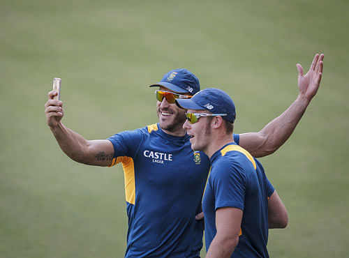 South Africa's Faf du Plessis and David Miller shoot a video during a practice session ahead of their second one-day international cricket match against India, in Indore. Reuters photo