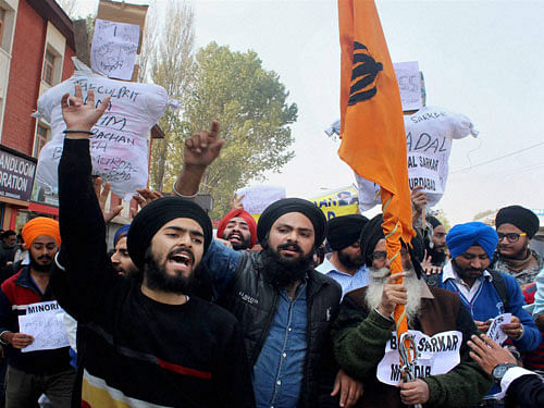 Sikh protesters during their protest against the alleged desecration of religious book. PTI Photo