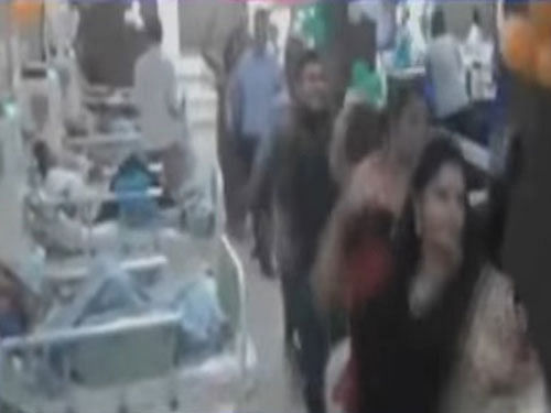 In the video, around 30 female as well as male staff members, including uniformed nurses, can be seen playing garba on loud music as patients looked on while resting on their beds. Screen grab.