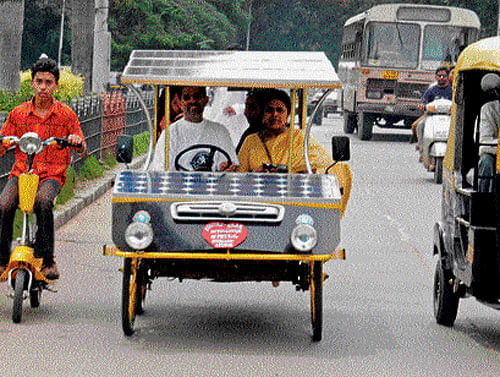 Syed Sajjad Ahmed driving his solar-powered car. file photo