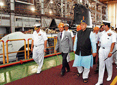 Finance Minister and former defence minister Arun Jaitley inspecting the Kalvari along with the Navy chief. The submarine is seen in the background. DH Photo