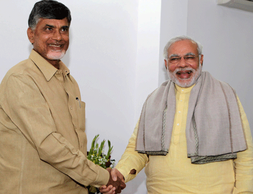 Andhra Pradesh Chief Minister N. Chandrababu Naidu with Modi, pti file photo