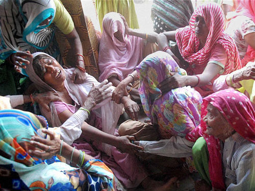 Relatives of victim crying after the house of a dalit was set on fire at Ballabgarh in Faridabad on Tuesday. PTI Photo