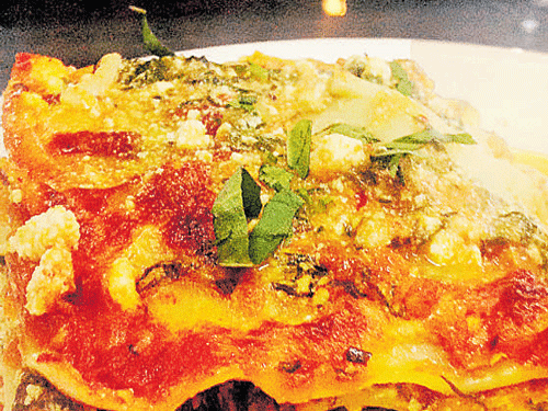 delicious Veg lasagne with garlic bread.