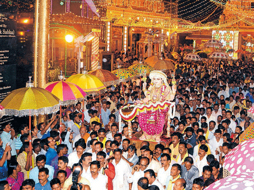 People gather in front of a temple in  Mangaluru on the last day of Navaratri. D