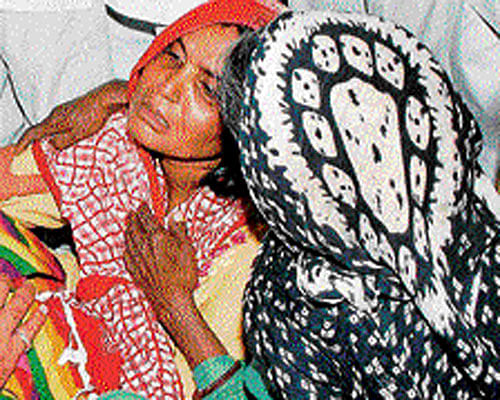 Wailing family members of Govinda, whose body was found hanging near his house in Gohana on Friday. PTI