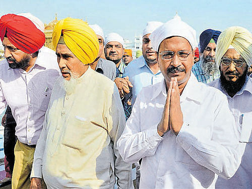 Chief Minister Arvind Kejriwal along with other AAP leaders pays obeisance at Golden Temple in Amritsar on Saturday. PTI
