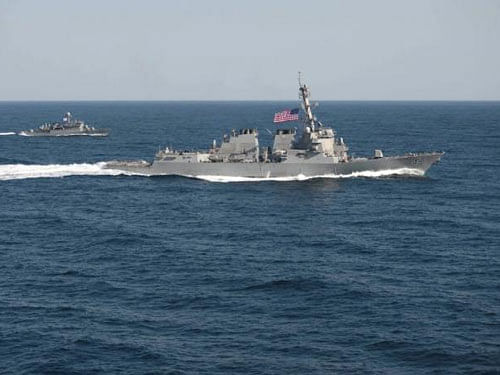 USS Lassen (DDG 82), (R) transits in formation with ROKS Sokcho (PCC 778) during exercise Foal Eagle 2015, in waters east of the Korean Peninsula, in this March 12, 2015, handout photo provided by the U.S. Navy. REUTERS Photo