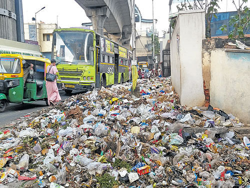 unattended: Garbage lies uncleared in Ulsoor on Tuesday. The situation isn't much different in several other localities.  dh Photo