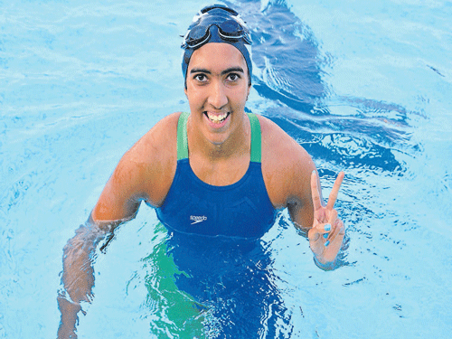 GREAT START: Karnataka's Malavika V strikes a happy pose after winning the women's 400M freestyle on Wednesday.