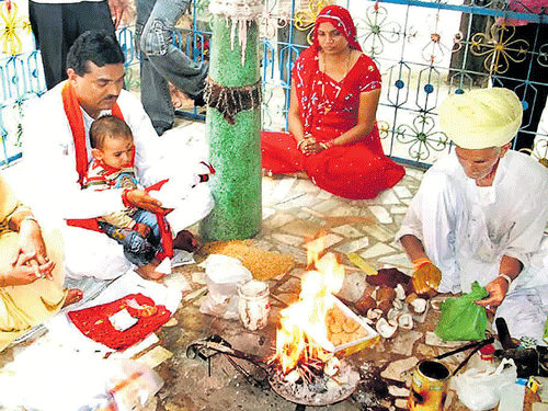 Head priest Jamaludin Khan performs homa inside the Durga temple at Bagoriya village in Rajasthan.