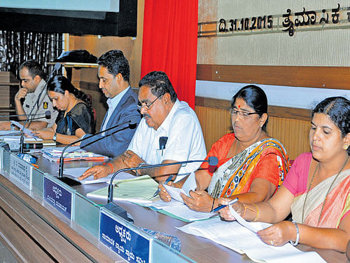 District In-Charge Minister B Ramanath Rai speaks at the tri-monthly KDP meeting in Mangaluru on Saturday.  Deputy Commissioner A B Ibrahim, Zilla Panchayat Chief Executive Officer P I Sreevidya and others look on. DH photo