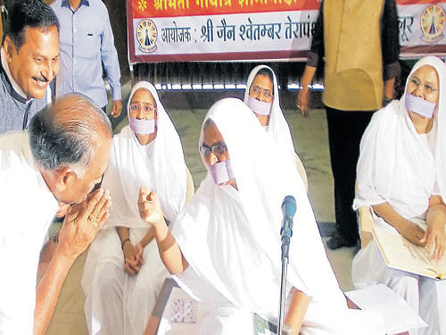 District In-charge Minister K Abhayachandra Jain is blessed by Sadhwis during 'Shraddha Samarpan' programme, organised by Jain Shwethambar Terapanth Sabha, at Chikkamagaluru on Sunday. Dh photo