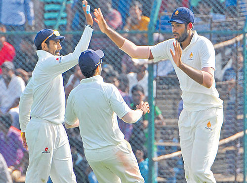 STRONG SHOW: Pacer David Mathias (right) grabbed three wickets to help Karnataka defeat Rajasthan by 92 runs on Monday. DH FILE PHOTO