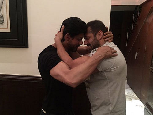 Bollywood superstar Shah Rukh Khan and Salman Khan, who are known to share a bittersweet bond, embraced each other on the former's 50th birthday. Their bonhomie was reflected in the chemistry they once shared onscreen in Karan Arjun. Image courtesy: Twitter