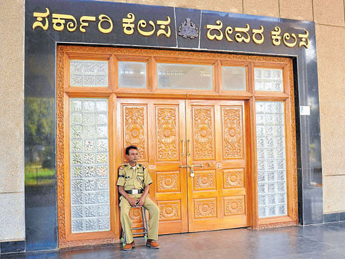 The deputy commissioner's (DC)&#8200;office complex was locked as government officials and employees boycotted work, condemning the attack on the DC in Chamarajanagar on Tuesday. The security guard too was seen wearing a black band as a mark of protest. DH photo