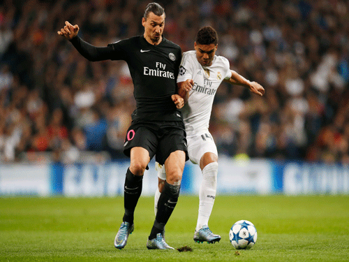 Paris St Germain's Zlatan Ibrahimovic and Real Madrid's Casemiro in action. Reuters Photo.