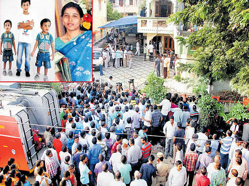 People gather outside the residence of former Congress MP Sircilla Rajaiah after his daughter-in-law and three grandchildren (inset) were charred to death at their house on Tuesday night in Warangal on Wednesday. PTI/ DH PHOTO
