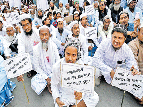 Fight for peace: People hold placards to protest against the rise in intolerance in Kolkata on Wednesday. PTI