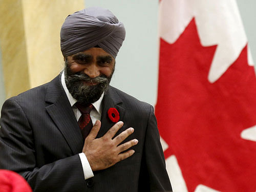 Canada's new National Defence Minister Harjit Sajjan gestures after being sworn-in during a ceremony at Rideau Hall in Ottawa. Reuters photo