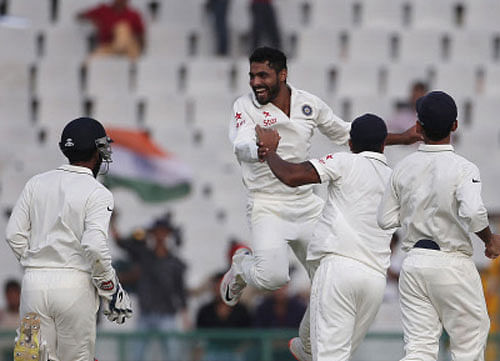 Jadeja celebrates with his teammates after dismissing South Africa's Plessis during the first day of their first cricket test match, in Mohali. Reuters