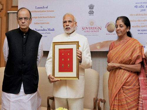 Modi launched the gold monetisation scheme to convert jewellery and other yellow metal assets with people into interest-bearing deposits, and the sovereign bond scheme with an eight-year tenure, while allowing an exit option after five years. PTI photo