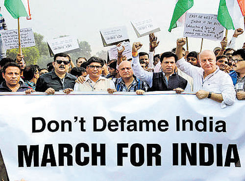 Anupam Kher and other film personalities march to counter the protests against intolerance, in New Delhi on Saturday. PTI