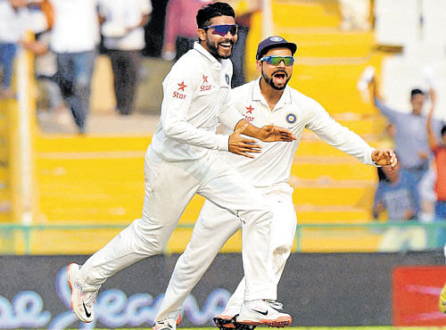 WRECKER-IN-CHIEF India's Ravindra Jadeja (left) celebrates with skipper Virat Kohli after dismissing Dane Vilas of South Africa on Saturday at Mohali. The hosts registered a 108-run win to take a 1-0 lead in the four-match Test series. PTI