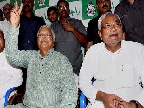 Bihar Chief Minister Nitish Kumar and RJD chief Lalu Prasad after Mahagathbandhan's (Grand Alliance) victory in Bihar assembly elections at RJD office in Patna on Sunday. PTI Photo