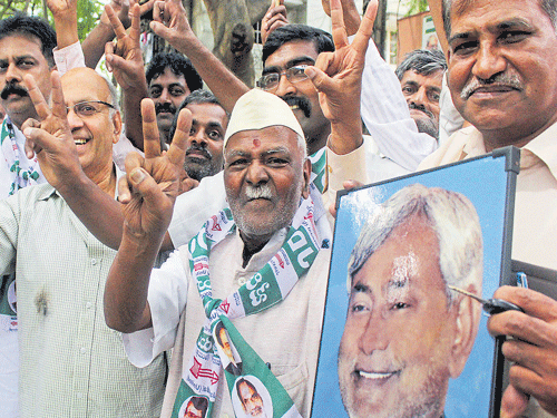 In Celebration mood: JD (U) workers celebrate the victory in Bihar at the party office in Bengaluru on Sunday.  DH Photo