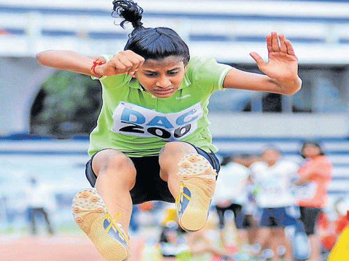 winning leap: HH&#8200;Preethi Chand of Sophia School en route her gold in the U-15 long jump on Sunday. dh photo