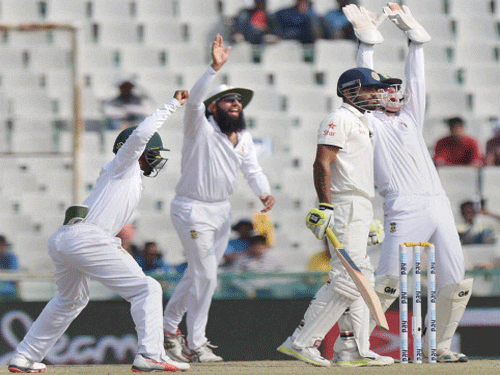 South African players successfully appeal for the wicket of Indian batsman R Jadeja during the 3rd day of first Test match in Mohali on Saturday. PTI Photo.