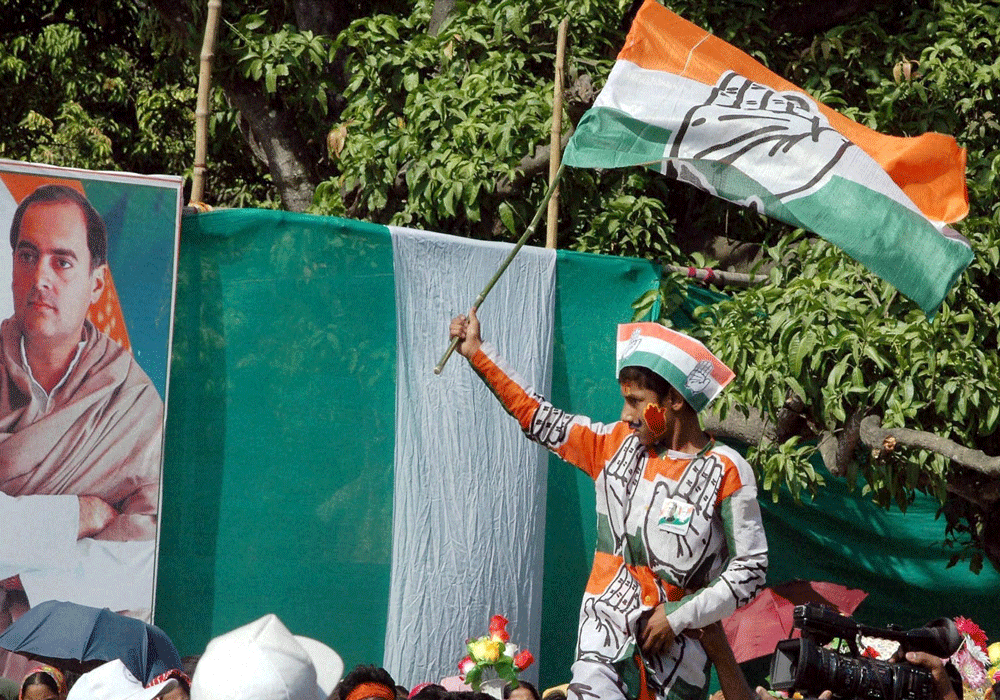 As it became clear that the Congress was set to improve its tally way beyond it had anticipated, Youth Congress activists trooped at the gates waving party flags and beating drums. PTI file photo