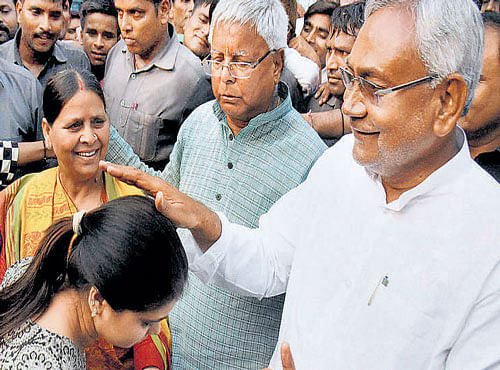 Chief Minister Nitish Kumar with family members of RJD chief Lalu Prasad in Patna on Sunday. PTI