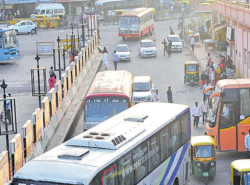 These private buses are causing confusion and disrupting vehicular movement on busy roads. DH FILE PHOTO