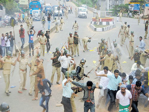 Police cane a mob during clashes over Tipu Sultan birth  anniversary celebrations in Madikeri on Tuesday. DH photo