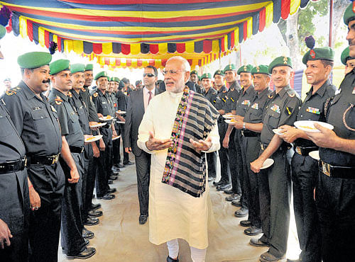PM Narendra Modi greets soldiers on Deepavali at the Barki memorial, Ferozepur, Punjab on Wednesday. PTI