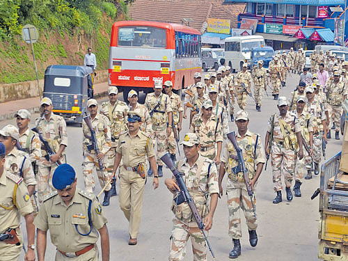 Peacekeepers: Security forces take out a flag march to instil confidence among the people in Madikeri on Thursday.   DH&#8200;PHOTO