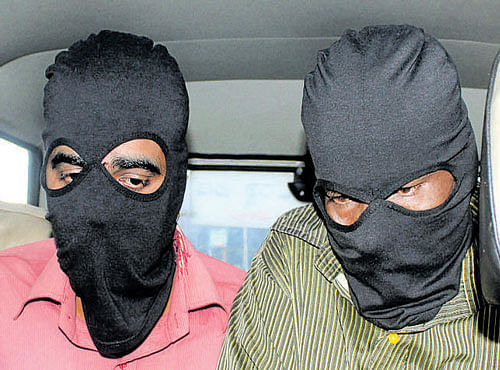 The two accused being taken to a court in connection with the gang-rape case, in Bengaluru on Thursday. KPN